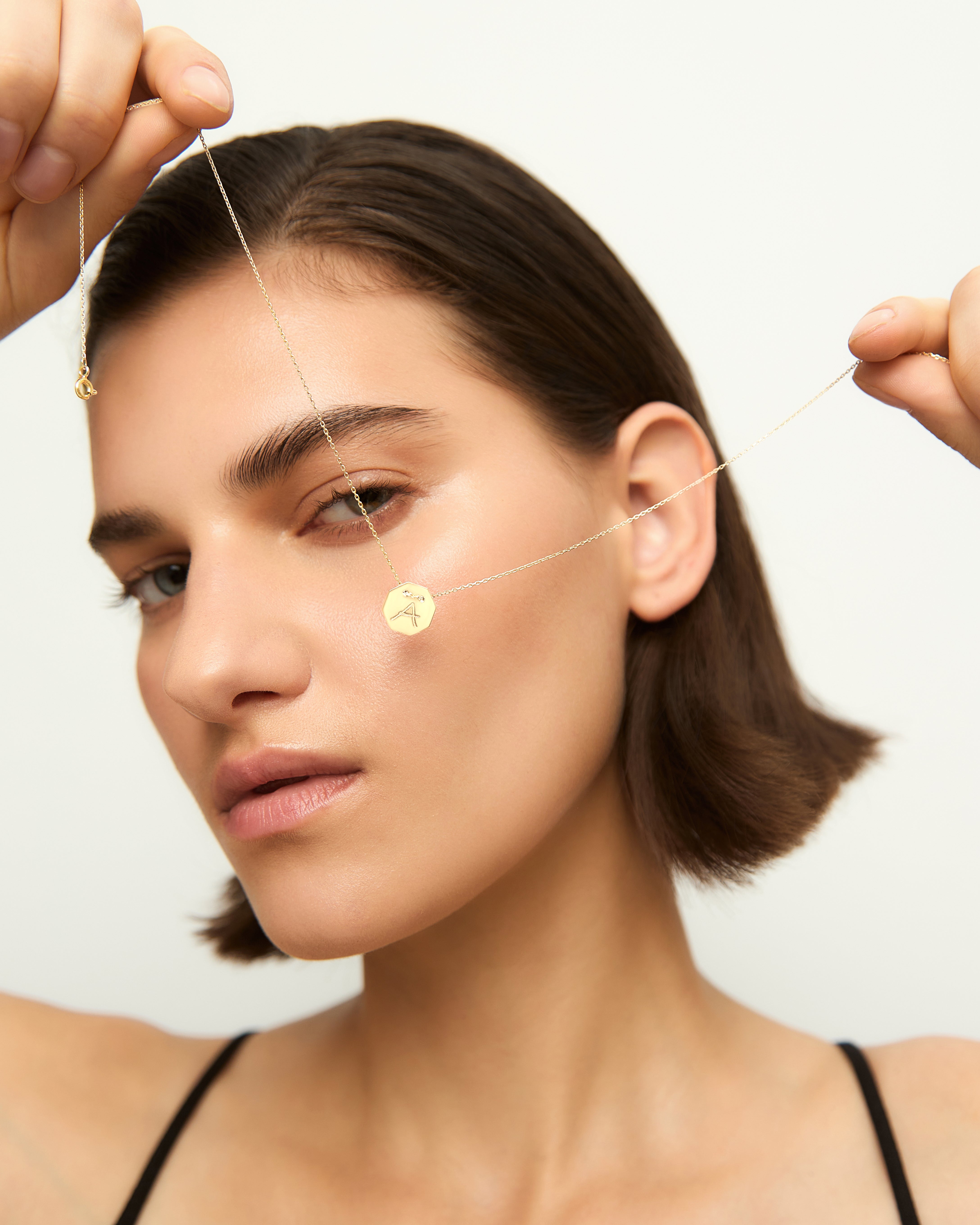 Yellow gold Letters medallion