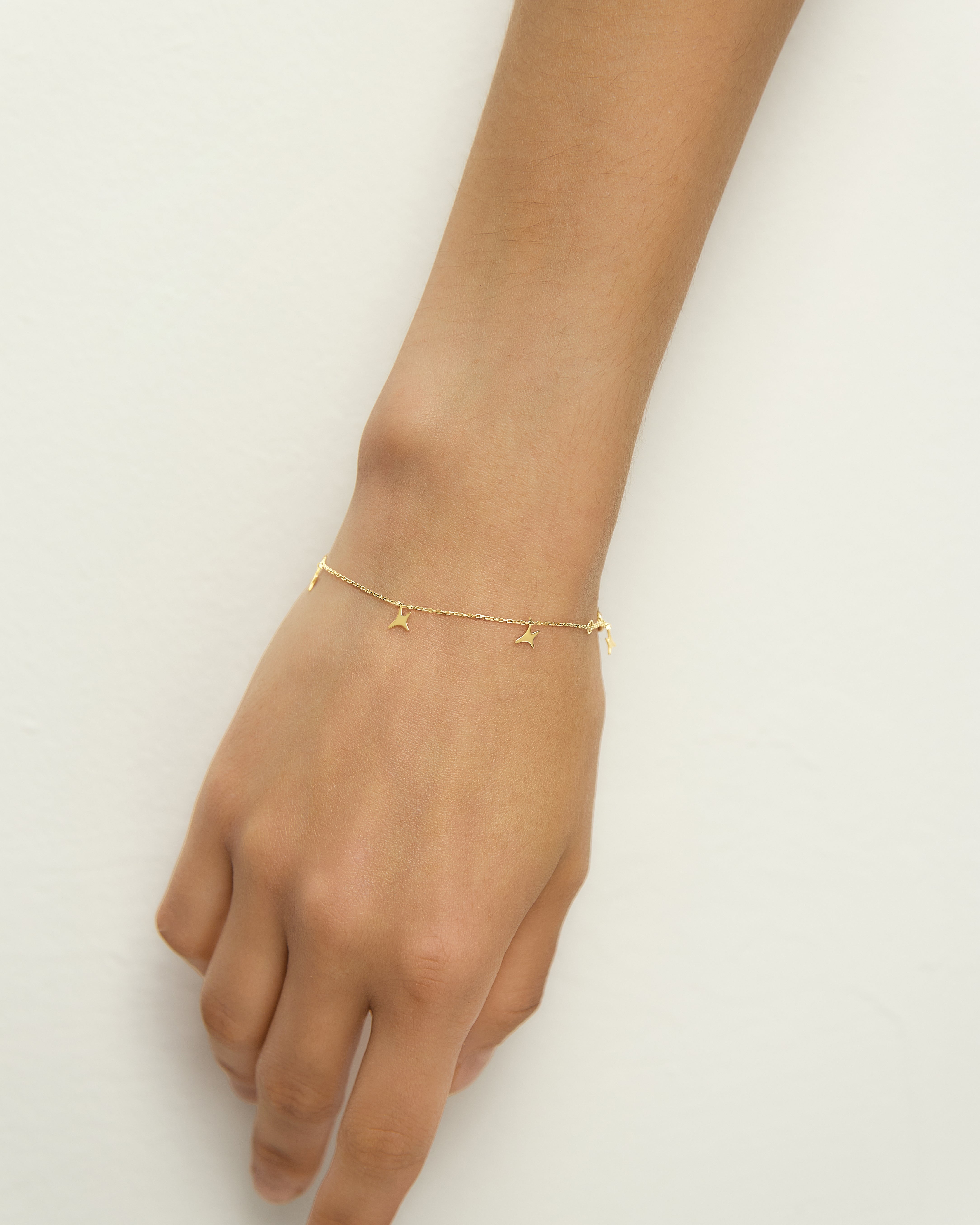 Pulsera AUMI estrellas oro amarillo