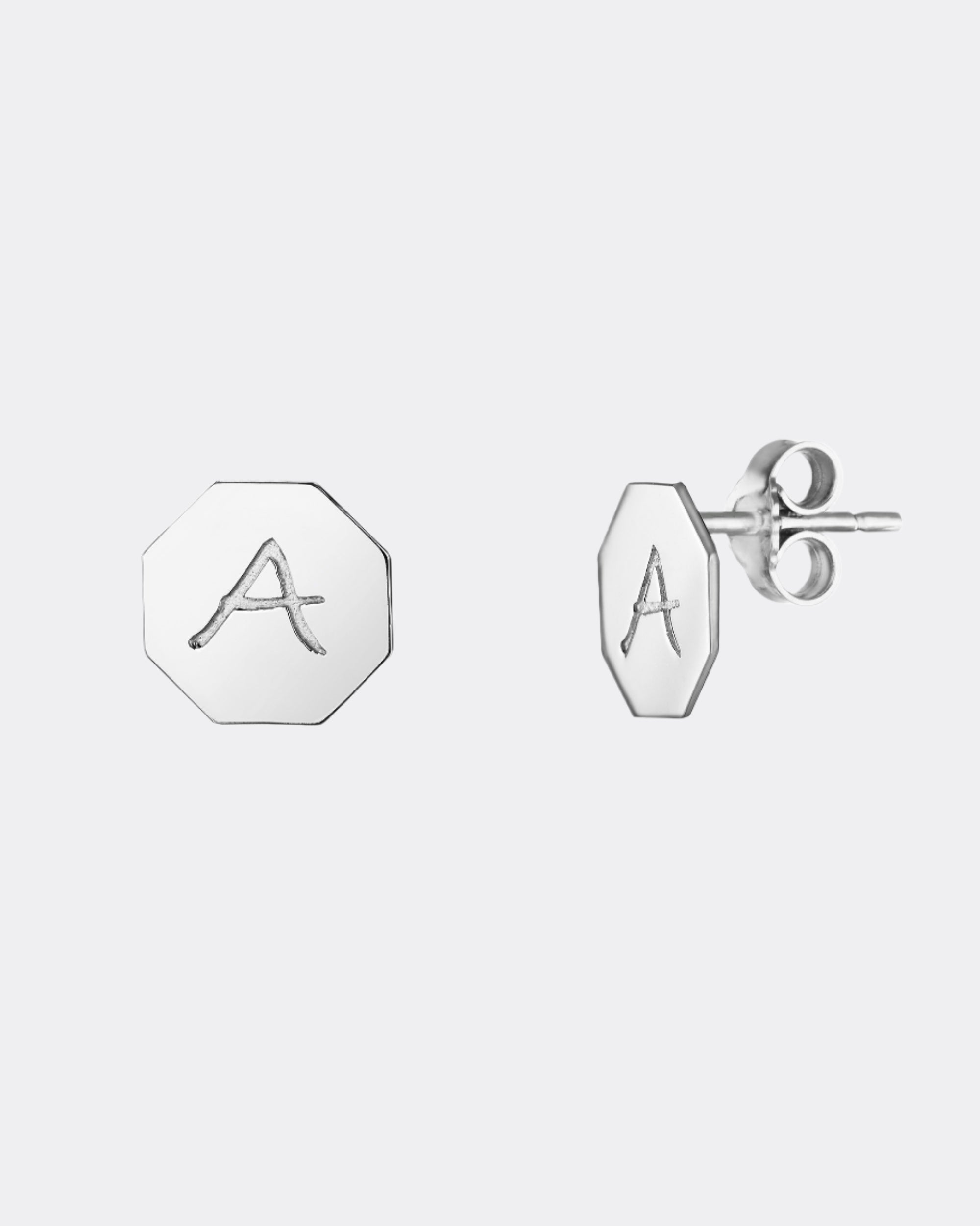 Silver earrings with letter 'A' on a white background