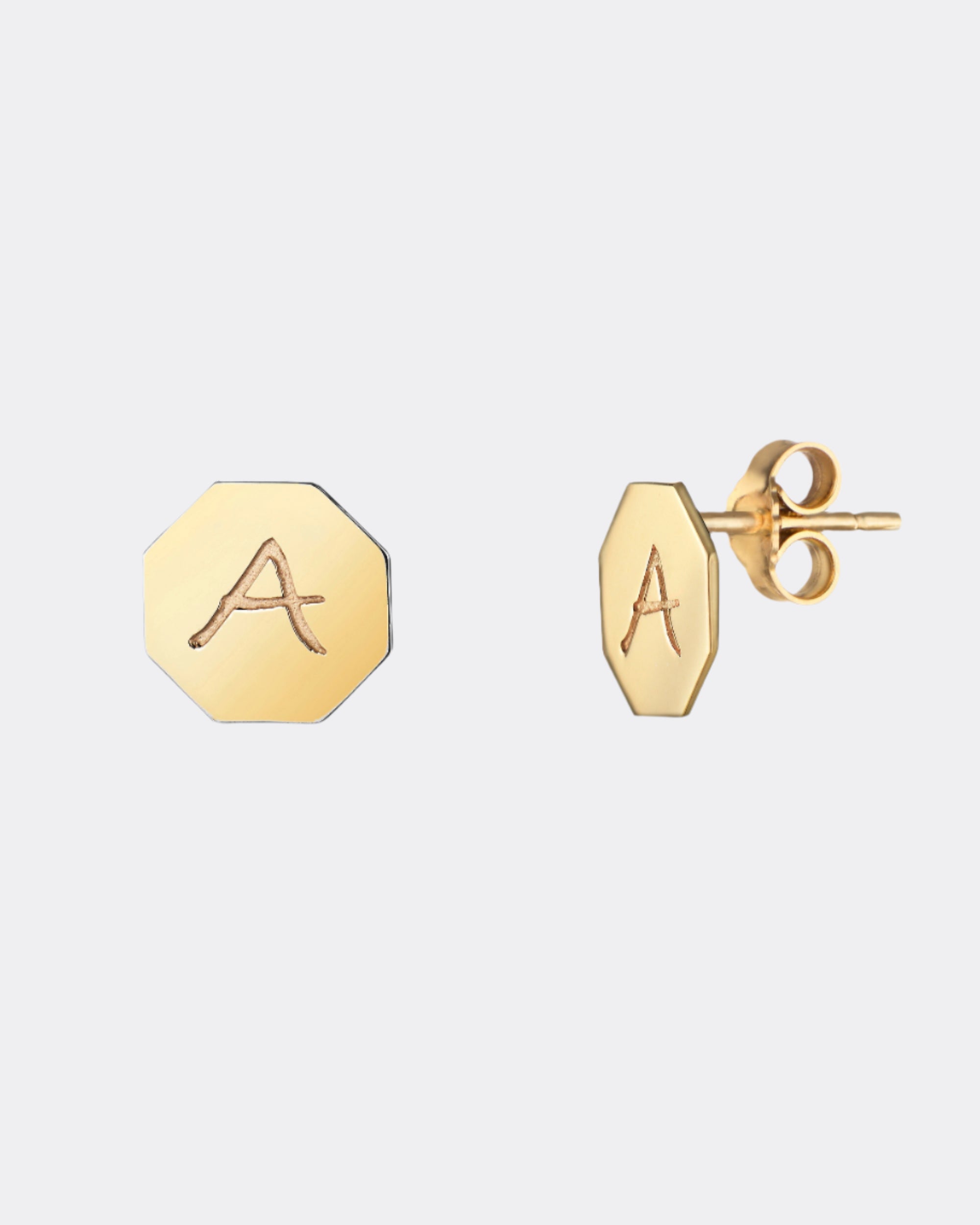 Gold earrings with 'A' initials on a white background